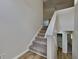 Carpeted staircase with white railing leading to the upper level of the home at 11616 Spring Lake Way, Fayetteville, GA 30215