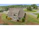 Aerial shot of a house highlighting the backyard, mature trees, and surrounding neighborhood at 2076 Towne Mill Ave, Canton, GA 30114