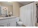 Bathroom features granite counters, white cabinets, and shower with curtain at 2076 Towne Mill Ave, Canton, GA 30114