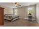 Bedroom with neutral carpeting, a bed, and an office area at 2076 Towne Mill Ave, Canton, GA 30114