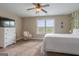 Bedroom featuring a ceiling fan, wall decor and a hanging chair near the window at 2076 Towne Mill Ave, Canton, GA 30114