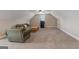 Spacious bonus room with plush carpeting, ideal for entertainment and relaxation at 2076 Towne Mill Ave, Canton, GA 30114