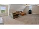 Comfortable bonus room featuring plush carpeting, natural light, and cozy seating at 2076 Towne Mill Ave, Canton, GA 30114