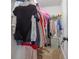 Walk-in closet with wire shelves and various articles of clothing at 2076 Towne Mill Ave, Canton, GA 30114