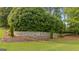 Stone community sign set amongst manicured lawns at 2076 Towne Mill Ave, Canton, GA 30114