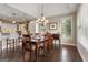 Elegant dining room with modern chandelier adjacent to the kitchen, perfect for entertaining guests at 2076 Towne Mill Ave, Canton, GA 30114