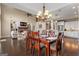 Open-concept dining room with a view of the kitchen and living area, with hardwood floors at 2076 Towne Mill Ave, Canton, GA 30114