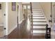 Inviting foyer with hardwood floors, a staircase, and natural light streaming through the windows at 2076 Towne Mill Ave, Canton, GA 30114