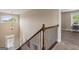 Second floor hallway with wooden railing and chandelier over the staircase at 2076 Towne Mill Ave, Canton, GA 30114