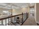Upstairs hallway features an open railing and coffered ceilings at 2076 Towne Mill Ave, Canton, GA 30114