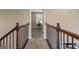 Second story hallway looking into a study area with neutral walls and carpeting at 2076 Towne Mill Ave, Canton, GA 30114