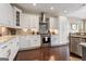 Bright kitchen featuring white cabinets, stainless steel appliances, and granite countertops at 2076 Towne Mill Ave, Canton, GA 30114