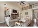 Cozy living room featuring a stone fireplace, hardwood floors, high ceilings, and comfortable seating at 2076 Towne Mill Ave, Canton, GA 30114