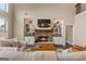 Inviting living room features a stone fireplace with built-in shelving and a cozy seating arrangement at 2076 Towne Mill Ave, Canton, GA 30114