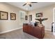 Office space with a large desk, windows, and neutral carpeting at 2076 Towne Mill Ave, Canton, GA 30114