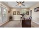 Well-lit office space with a large desk, and a ceiling fan at 2076 Towne Mill Ave, Canton, GA 30114