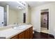 Bathroom features a vanity with a sink, mirror, toilet and a closet with lots of room for storage at 3775 Highway 16 E, Sharpsburg, GA 30277