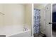 The bathroom includes a tub/shower combo with a unique shower curtain and a door leading to another room at 3775 Highway 16 E, Sharpsburg, GA 30277