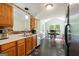 Eat-in kitchen featuring stainless appliances, and light wood cabinetry at 3775 Highway 16 E, Sharpsburg, GA 30277
