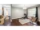 Bright exercise room features workout equipment, wood floors, and a window providing plenty of natural light at 3775 Highway 16 E, Sharpsburg, GA 30277