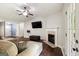 Bright living room boasts a fireplace, dark wood floors, and a door leading to the outside at 3775 Highway 16 E, Sharpsburg, GA 30277