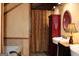 Rustic bathroom with a vanity and curtained bath/shower at 460 Morgan Mill Rd, Brooks, GA 30205