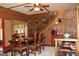 Dining room features a wooden table, wooden walls, and a staircase at 460 Morgan Mill Rd, Brooks, GA 30205