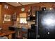 Unique kitchen with wood cabinets, black appliances, and natural light at 460 Morgan Mill Rd, Brooks, GA 30205