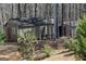 Outbuilding on the property with green shrubs in the foreground at 460 Morgan Mill Rd, Brooks, GA 30205