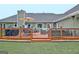 Wooden deck featuring outdoor furniture, a grill, and an umbrella for shade at 175 Thomas Overby Dr, Sharpsburg, GA 30277