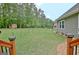 The backyard features a meticulously maintained lawn enclosed by a fence, offering a secure outdoor space at 175 Thomas Overby Dr, Sharpsburg, GA 30277