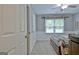 Spacious bedroom with large window, carpeted floors, and wooden furniture set at 175 Thomas Overby Dr, Sharpsburg, GA 30277