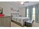 Comfortable bedroom featuring a ceiling fan, neutral walls, and scenic canvas art at 175 Thomas Overby Dr, Sharpsburg, GA 30277