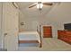 Cozy bedroom featuring neutral walls, plush carpet, and an ample dresser at 175 Thomas Overby Dr, Sharpsburg, GA 30277