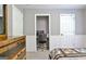 A bedroom with wainscoting and a small computer desk in converted closet space at 175 Thomas Overby Dr, Sharpsburg, GA 30277
