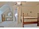 Cozy attic bedroom with neutral carpet, furniture, and a large storage vanity at 175 Thomas Overby Dr, Sharpsburg, GA 30277