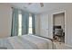 Bedroom with windows, curtains, a ceiling fan, and access to a connected office space at 175 Thomas Overby Dr, Sharpsburg, GA 30277