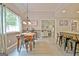 Cozy dining area with natural light and an open floor plan connecting to the kitchen and living area at 175 Thomas Overby Dr, Sharpsburg, GA 30277