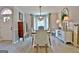 The dining room is enhanced by bay windows and an elegant light fixture at 175 Thomas Overby Dr, Sharpsburg, GA 30277