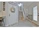 Inviting entryway with decor, stairs and luxury vinyl plank flooring for a modern look at 175 Thomas Overby Dr, Sharpsburg, GA 30277