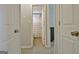 Hallway view showcasing access to a bathroom with a shower and potential bedrooms at 175 Thomas Overby Dr, Sharpsburg, GA 30277