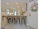 Beautiful kitchen with granite countertops and stainless steel appliances, with a welcoming front door at 175 Thomas Overby Dr, Sharpsburg, GA 30277