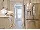 Bright kitchen with stainless steel refrigerator and white cabinets at 175 Thomas Overby Dr, Sharpsburg, GA 30277