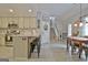 Charming kitchen features granite counters, stainless appliances, and a breakfast bar with wood accents at 175 Thomas Overby Dr, Sharpsburg, GA 30277