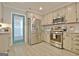 Well-equipped kitchen with stainless steel appliances and custom cabinets, offering ample storage space at 175 Thomas Overby Dr, Sharpsburg, GA 30277