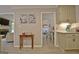 View from living room to dining area featuring fireplace, decor, and access to kitchen at 175 Thomas Overby Dr, Sharpsburg, GA 30277