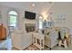 This spacious living room features bright windows and a cozy seating area at 175 Thomas Overby Dr, Sharpsburg, GA 30277