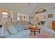 This spacious living room features a comfortable seating area and seamlessly connects to the kitchen at 175 Thomas Overby Dr, Sharpsburg, GA 30277