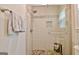 Modern shower featuring subway tile, mosaic accents, glass doors, and stylish fixtures at 175 Thomas Overby Dr, Sharpsburg, GA 30277