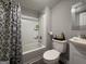 Clean bathroom with a shower-tub combo, neutral decor, and essential amenities for comfort at 3456 Village Glen Ct, Snellville, GA 30039